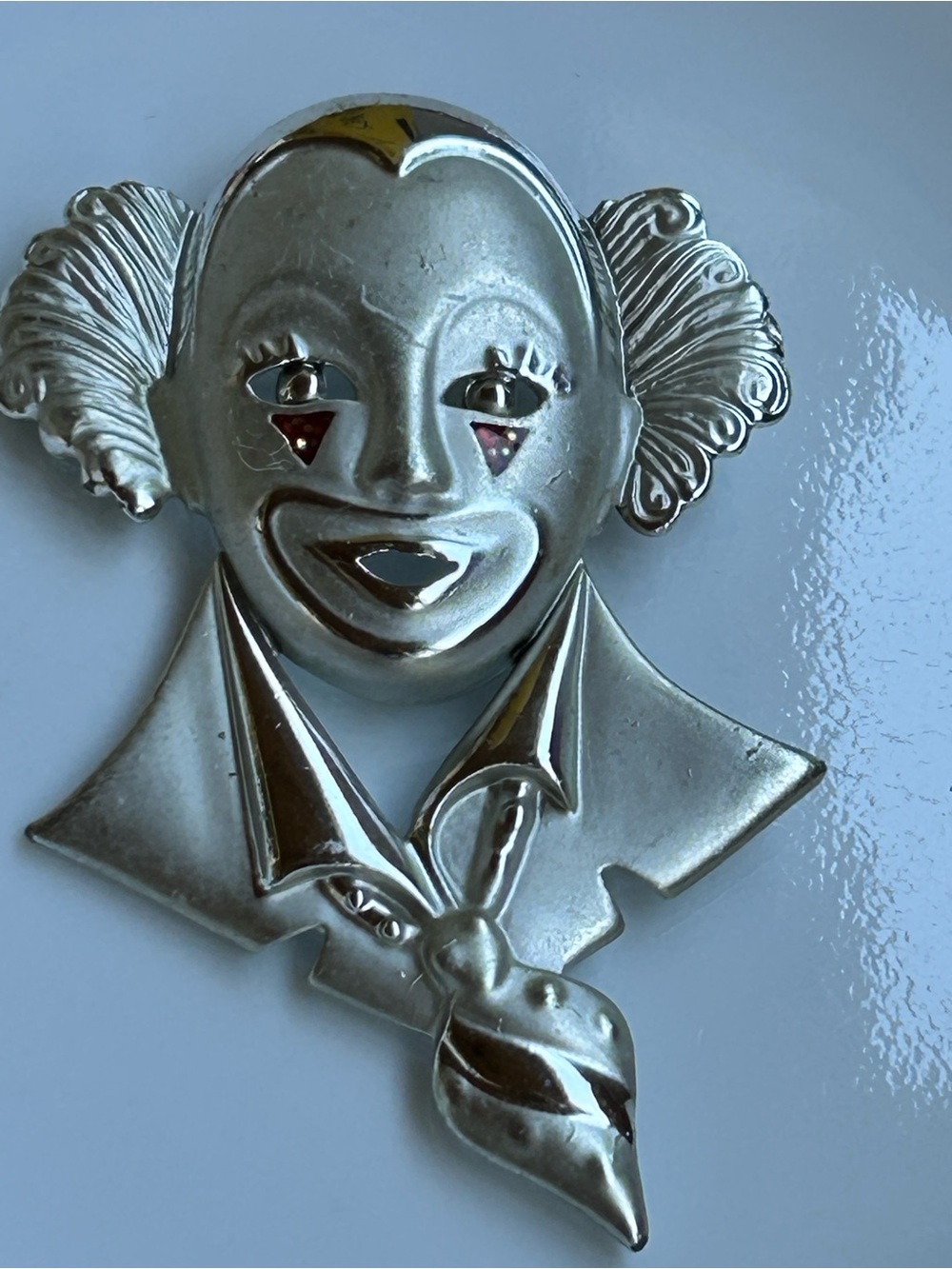 Vintage Silver Clown Brooch with Subtle Red Accents scratching wear